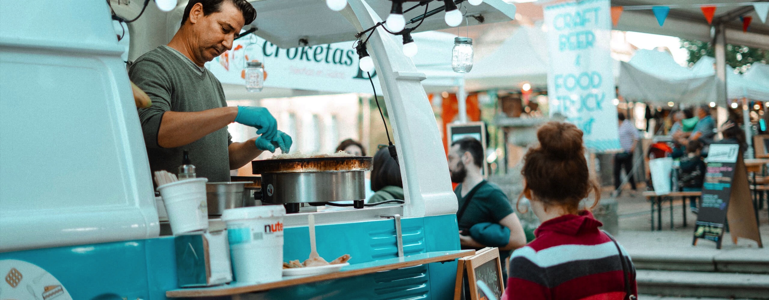 Image of a vendor serving from a food van